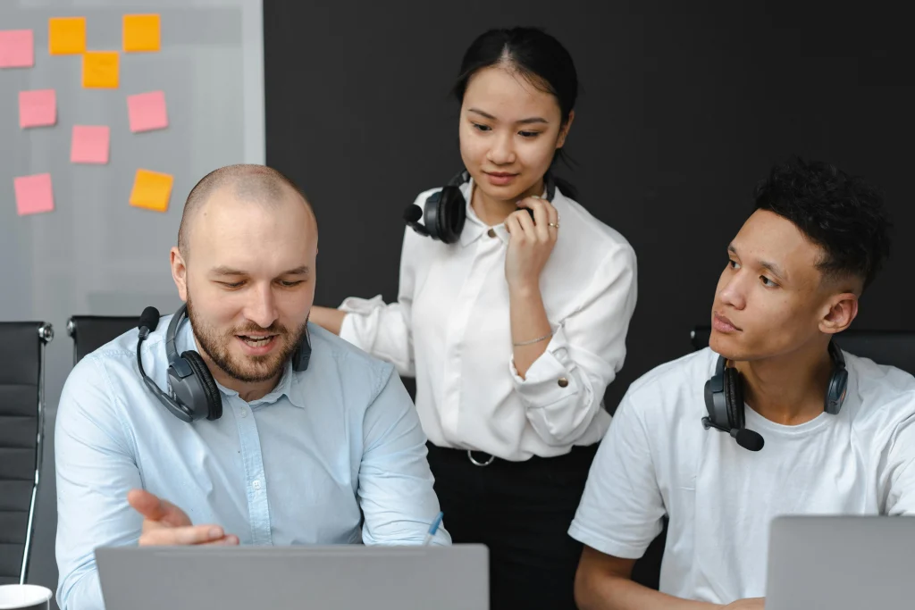 Administrative and executive support team collaborating on office operations and business support tasks in a professional outsourcing environment.